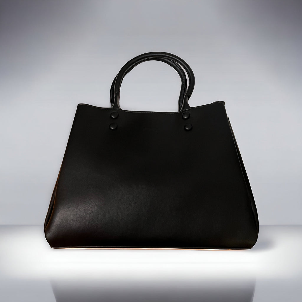 A black vegan leather mini tote bag with straps and a zipper closure.